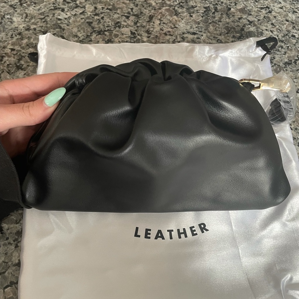 Understated Leather Crescent Clutch
